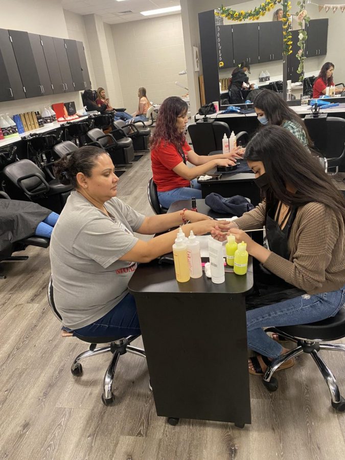 Custodians getting salon services from PHS cosmetology.
