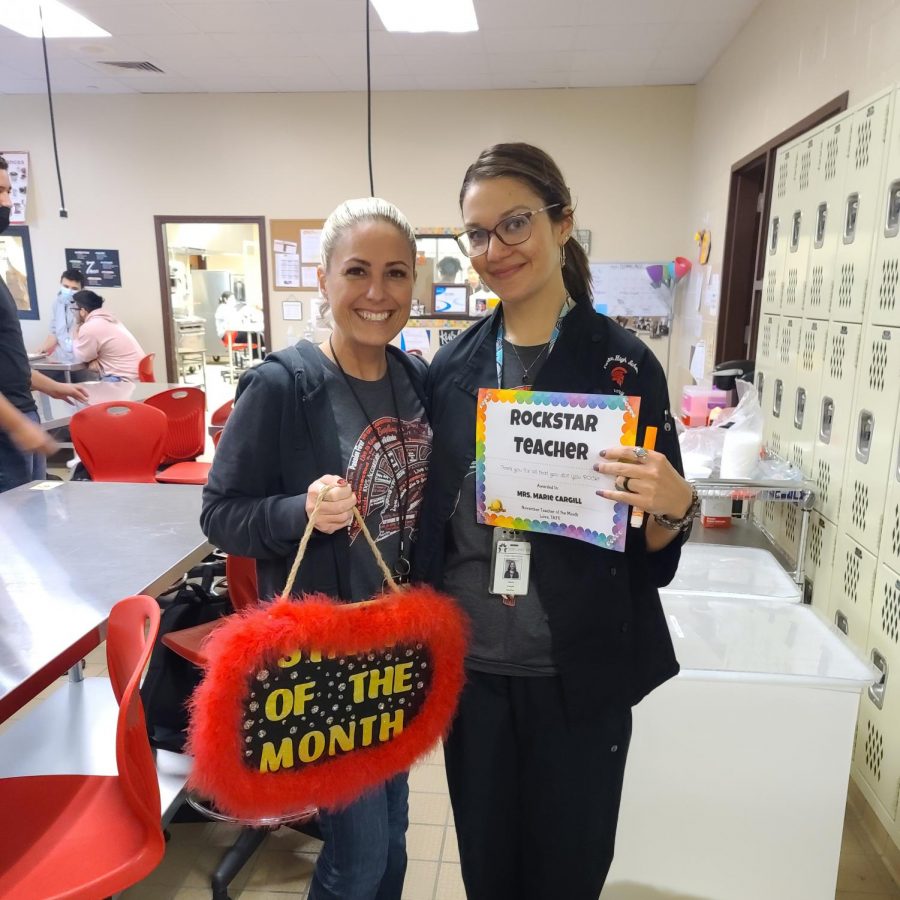 Marie Cargill (pictured right) is the PHS staff member of the month for November. The TAFE teacher, Ms. Newcomb, awarded her with her certificate and door sign.